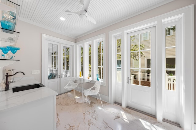 sunroom / solarium featuring french doors and a sink