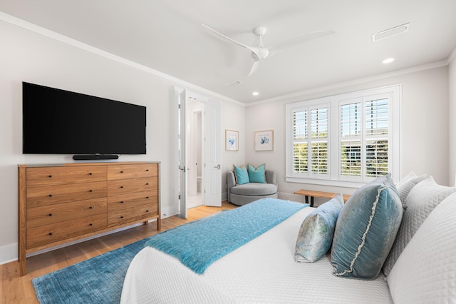 bedroom with recessed lighting, ornamental molding, baseboards, and wood finished floors