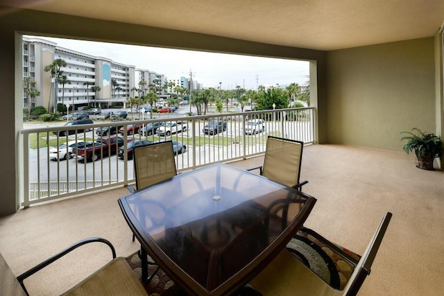 balcony with outdoor dining area