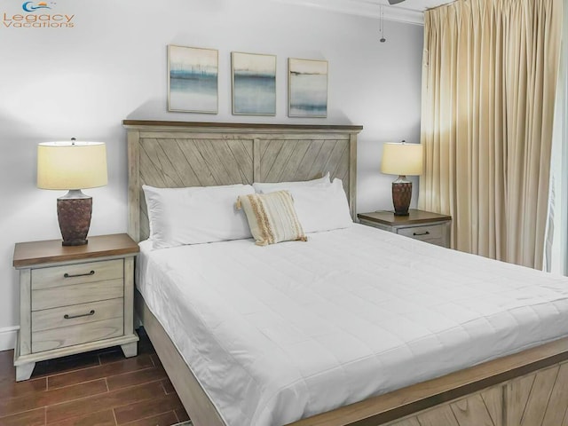 bedroom with wood tiled floor