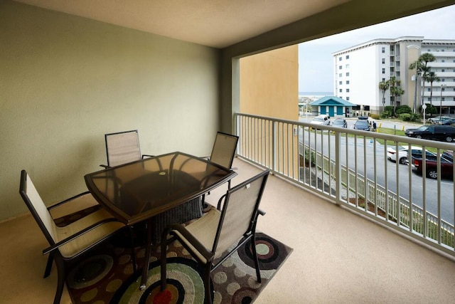 balcony featuring outdoor dining space