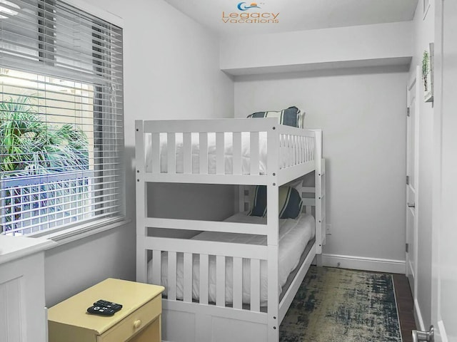 bedroom with multiple windows and baseboards