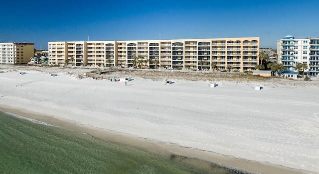 view of building exterior with a beach view