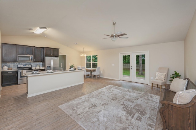 3362 Peeble Dr, Crestview, FL 32539 - kitchen featuring stainless steel appliances, vaulted ceiling, open floor plan, french doors, and backsplash