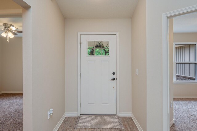 3362 Peeble Dr, Crestview, FL 32539 - carpeted entrance foyer featuring ceiling fan, baseboards, and wood finished floors