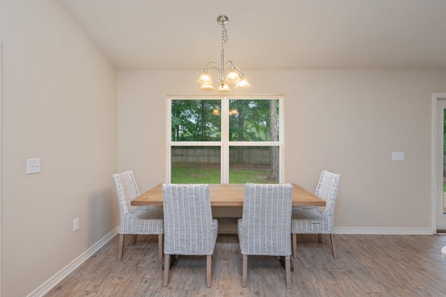 3362 Peeble Dr, Crestview, FL 32539 - dining space featuring wood finished floors, baseboards, and a chandelier