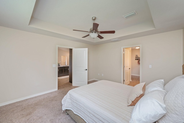 3362 Peeble Dr, Crestview, FL 32539 - bedroom with a tray ceiling, light carpet, baseboards, and ceiling fan