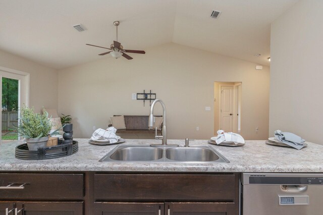 3362 Peeble Dr, Crestview, FL 32539 - kitchen featuring stainless steel dishwasher, a sink, dark brown cabinets, a ceiling fan, and vaulted ceiling
