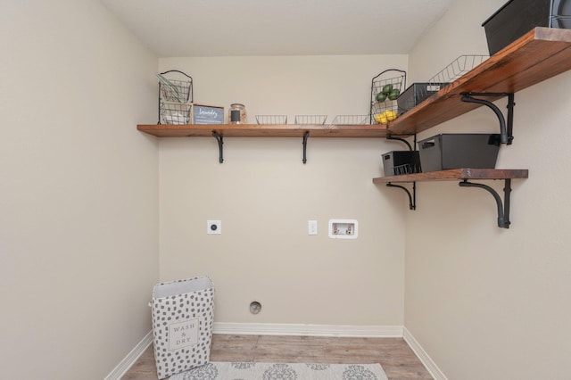 3362 Peeble Dr, Crestview, FL 32539 - clothes washing area with hookup for a washing machine, light wood-type flooring, baseboards, and hookup for an electric dryer