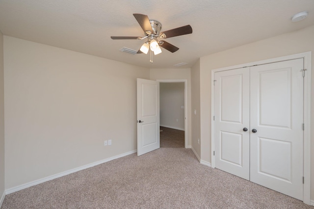 3362 Peeble Dr, Crestview, FL 32539 - unfurnished bedroom featuring light colored carpet, baseboards, a closet, and ceiling fan