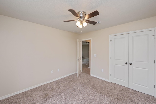 3362 Peeble Dr, Crestview, FL 32539 - unfurnished bedroom with light carpet, baseboards, a closet, and ceiling fan