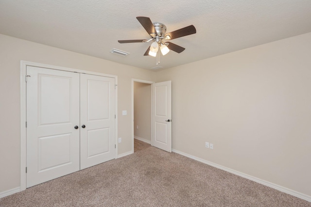 3362 Peeble Dr, Crestview, FL 32539 - unfurnished bedroom with carpet, baseboards, a closet, and ceiling fan