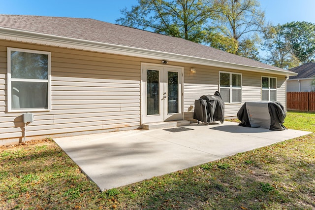 3362 Peeble Dr, Crestview, FL 32539 - back of property featuring french doors, a patio, and a shingled roof