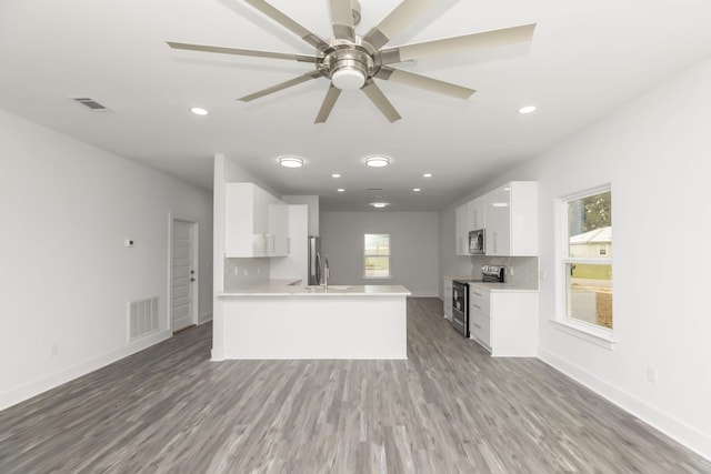 4446 Antioch Rd, Crestview, FL 32536 - kitchen featuring visible vents, appliances with stainless steel finishes, a healthy amount of sunlight, and light countertops