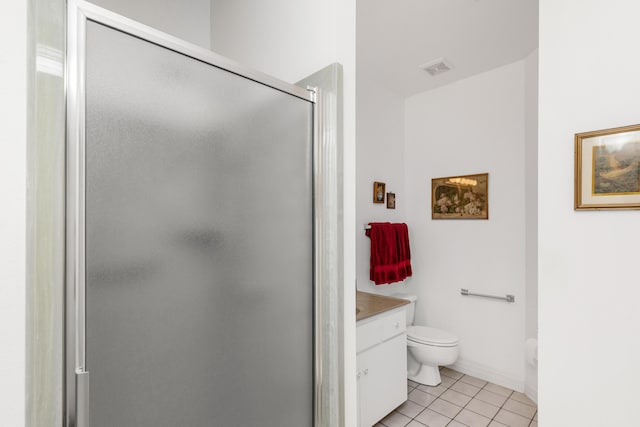 446 Marion Dr, Niceville, FL 32578 - bathroom with tile patterned flooring, toilet, vanity, baseboards, and a stall shower