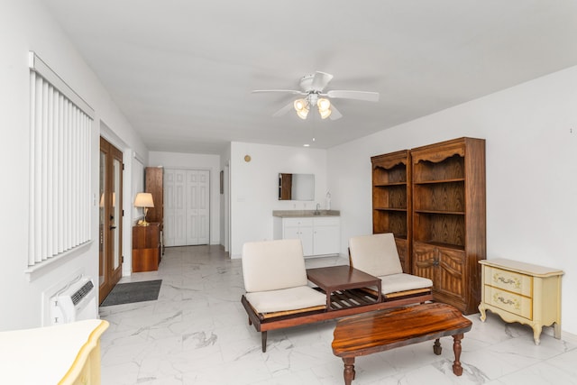 446 Marion Dr, Niceville, FL 32578 - living area featuring a ceiling fan, marble finish floor, and baseboards