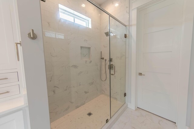 90 Montigo Ave, Santa Rosa Beach, FL 32459 - full bathroom with marble look tiles and a marble finish shower