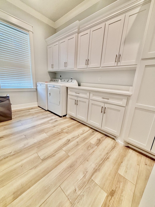 90 Montigo Ave, Santa Rosa Beach, FL 32459 - clothes washing area with cabinet space, independent washer and dryer, light wood finished floors, and ornamental molding