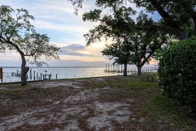 2894 Bay Grove Rd, Freeport, FL 32439 - yard at dusk with a water view
