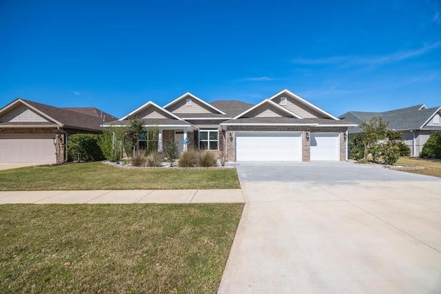 367 Brighton Cv, Freeport, FL 32439 - view of front of home featuring driveway, a garage, and a front lawn