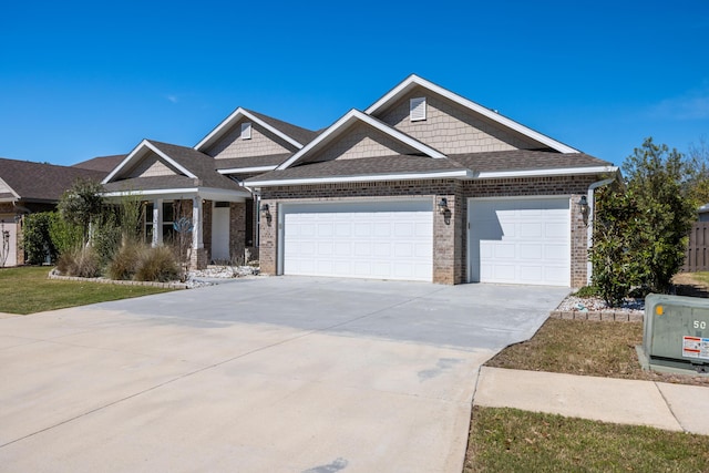 367 Brighton Cv, Freeport, FL 32439 - craftsman-style home with roof with shingles, an attached garage, brick siding, and concrete driveway