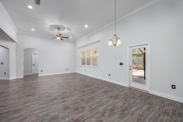 367 Brighton Cv, Freeport, FL 32439 - unfurnished living room featuring visible vents, ornamental molding, arched walkways, dark wood-type flooring, and ceiling fan with notable chandelier