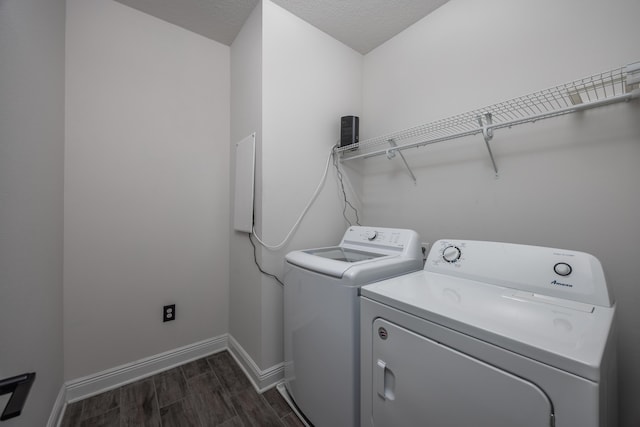 367 Brighton Cv, Freeport, FL 32439 - laundry room featuring a textured ceiling, baseboards, laundry area, dark wood-style floors, and washer and clothes dryer