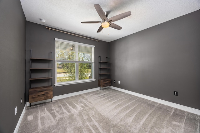 367 Brighton Cv, Freeport, FL 32439 - spare room featuring baseboards, a textured ceiling, a ceiling fan, and carpet