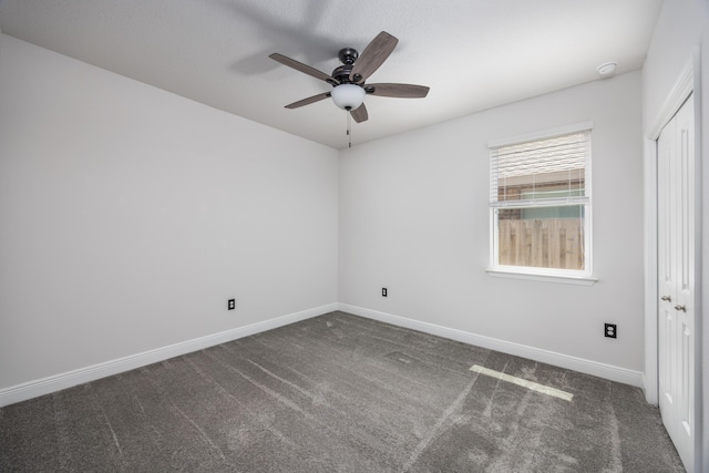 367 Brighton Cv, Freeport, FL 32439 - spare room featuring baseboards, ceiling fan, and dark carpet