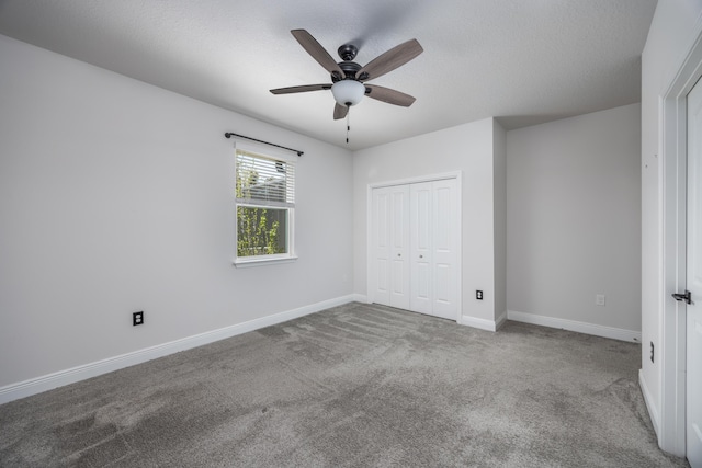 367 Brighton Cv, Freeport, FL 32439 - unfurnished bedroom featuring baseboards, carpet floors, a textured ceiling, and a closet