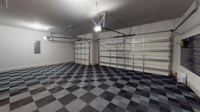 367 Brighton Cv, Freeport, FL 32439 - garage featuring electric panel, a garage door opener, and baseboards