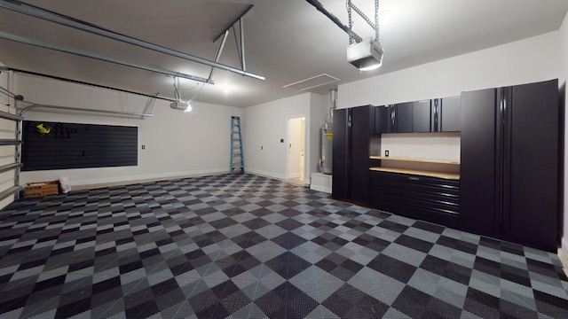 367 Brighton Cv, Freeport, FL 32439 - garage with baseboards and a garage door opener
