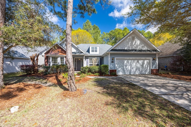 traditional home with driveway and an attached garage