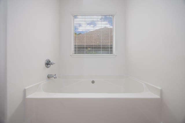 bathroom featuring a bath