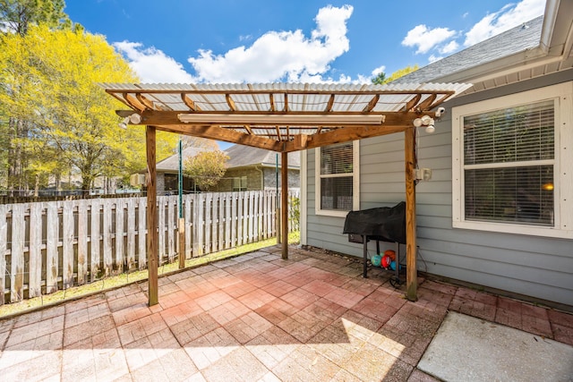 view of patio with fence and a pergola