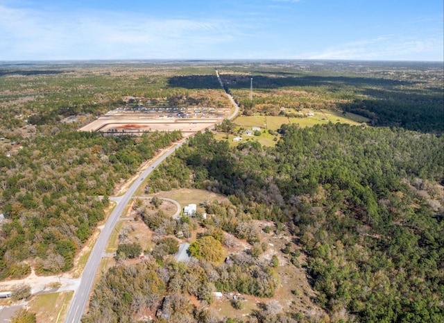 aerial view featuring a wooded view