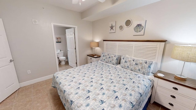 16819 Front Beach Rd Unit 210, Panama City Beach, FL 32413 - bedroom with tile patterned floors, ensuite bath, ceiling fan, and baseboards