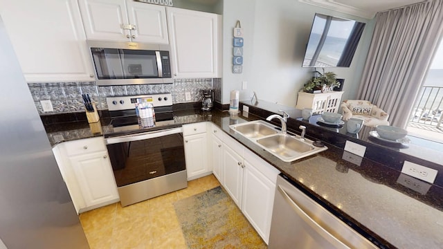 16819 Front Beach Rd Unit 210, Panama City Beach, FL 32413 - kitchen featuring appliances with stainless steel finishes, a sink, and white cabinetry