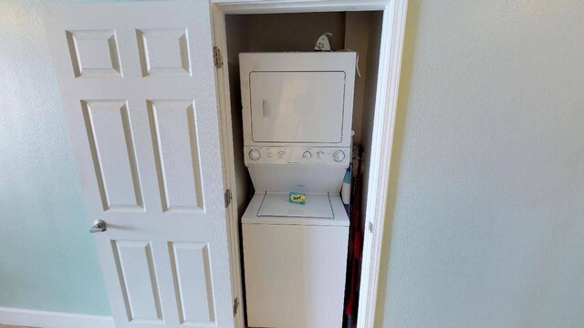 16819 Front Beach Rd Unit 210, Panama City Beach, FL 32413 - laundry room featuring estacked washer and dryer