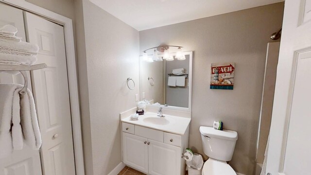 16819 Front Beach Rd Unit 210, Panama City Beach, FL 32413 - bathroom featuring vanity, toilet, and tile patterned flooring