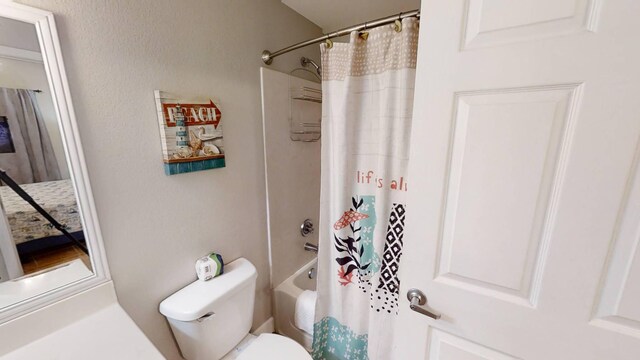 16819 Front Beach Rd Unit 210, Panama City Beach, FL 32413 - bathroom featuring toilet and shower / tub combo with curtain