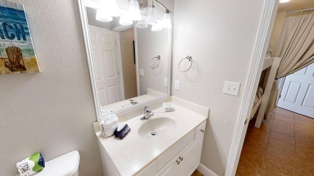 16819 Front Beach Rd Unit 210, Panama City Beach, FL 32413 - bathroom with toilet, vanity, and tile patterned flooring