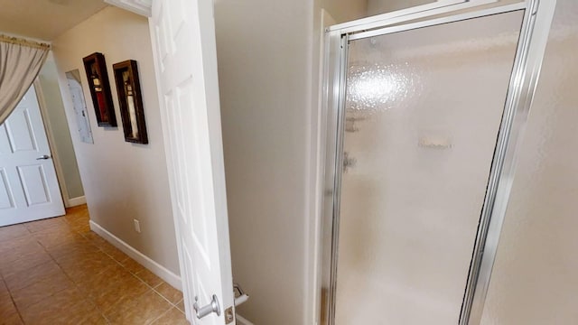 16819 Front Beach Rd Unit 210, Panama City Beach, FL 32413 - full bathroom with a shower stall, baseboards, and tile patterned floors