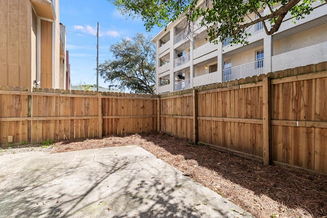 view of yard featuring a patio area and fence