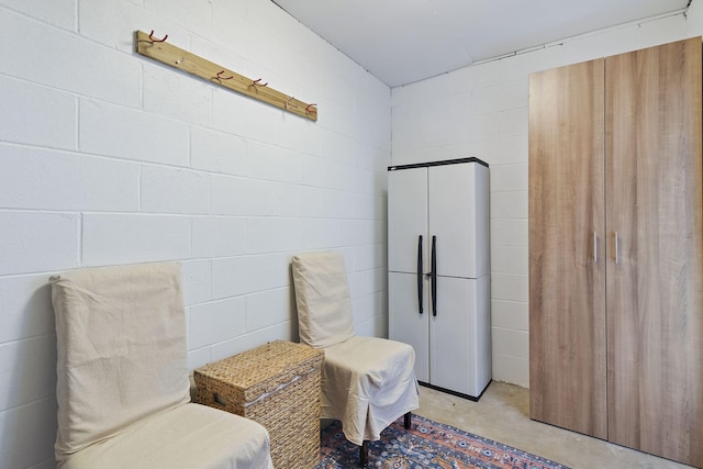 2381 W County Highway 30a Unit 8, Santa Rosa Beach, FL 32459 - living area with unfinished concrete floors and concrete block wall