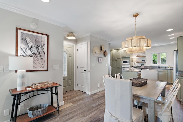 2381 W County Highway 30a Unit 8, Santa Rosa Beach, FL 32459 - dining room with light wood-type flooring, recessed lighting, and ornamental molding
