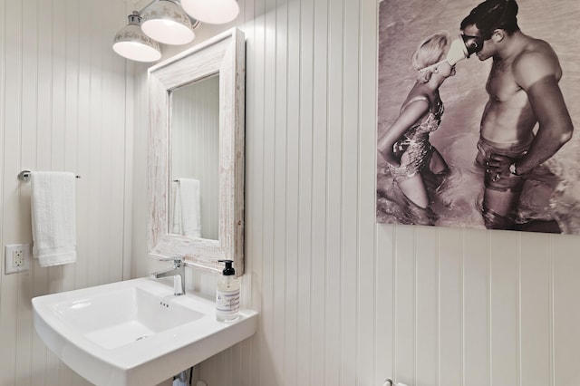 2381 W County Highway 30a Unit 8, Santa Rosa Beach, FL 32459 - bathroom featuring a sink and wood walls