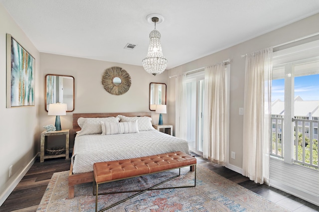 2381 W County Highway 30a Unit 8, Santa Rosa Beach, FL 32459 - bedroom with access to outside, wood finished floors, and a chandelier