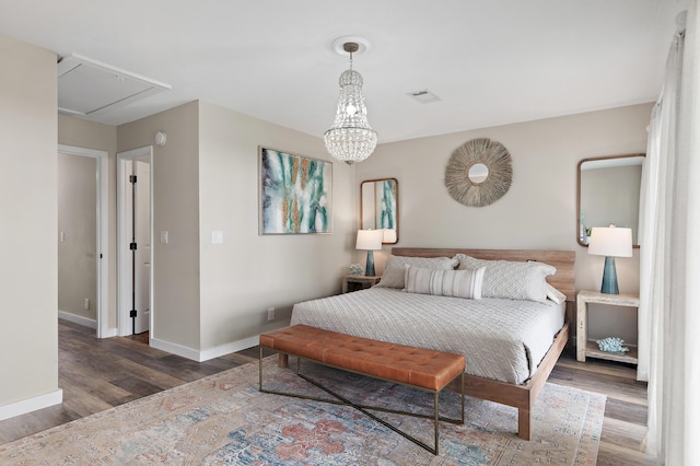 2381 W County Highway 30a Unit 8, Santa Rosa Beach, FL 32459 - bedroom with wood finished floors, attic access, and a chandelier