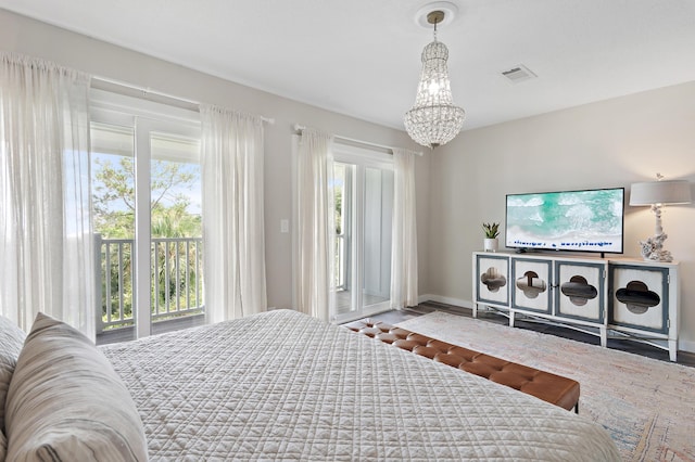 2381 W County Highway 30a Unit 8, Santa Rosa Beach, FL 32459 - bedroom with a chandelier and access to outside